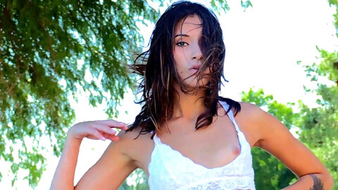 Brunette Roxanna with natural tits fingering her shaved pussy