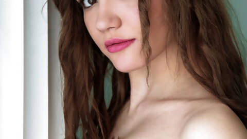 Ukrainian teen Carrie spreads her pussy while posing in her nylon stockings